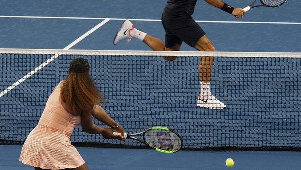 Roger Federer of Switzerland returns the ball to Serena Williams of the United states during their mixed doubles match at the Hopman Cup in Perth, Australia, Tuesday, 1, Jan. 2019 - Sputnik International