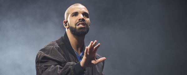 In this Oct. 8, 2016 file photo, Drake performs onstage in Toronto. Drake along with Rihanna and Kanye West scored eight Grammy nominations each, announced Tuesday, Dec. 6. - Sputnik International