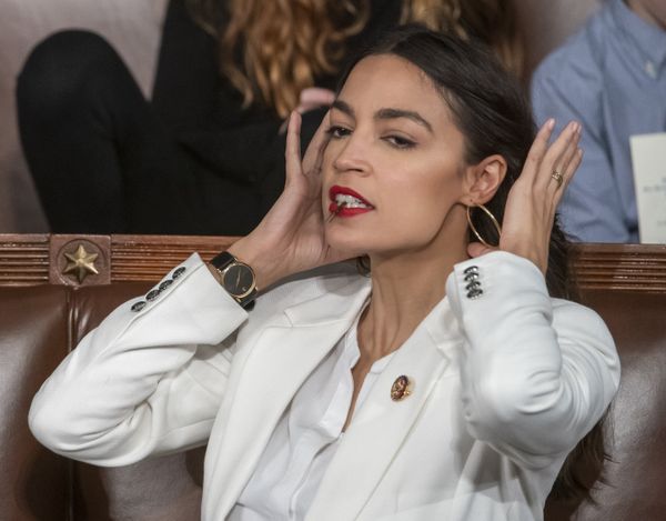 Rep. Alexandria Ocasio-Cortez, D-N.Y., holds a hair clip between her teeth as she pulls her hair back, on the opening day of the 116th Congress, at the Capitol in Washington, Thursday, Jan. 3, 2019 Rep. Alexandria Ocasio-Cortez, D-N.Y., holds a hair clip between her teeth as she pulls her hair back, on the opening day of the 116th Congress, at the Capitol in Washington, Thursday, Jan. 3, 2019 - Sputnik International