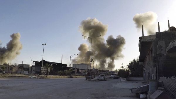 This photo released by the Syrian Civil Defense White Helmets - Sputnik International