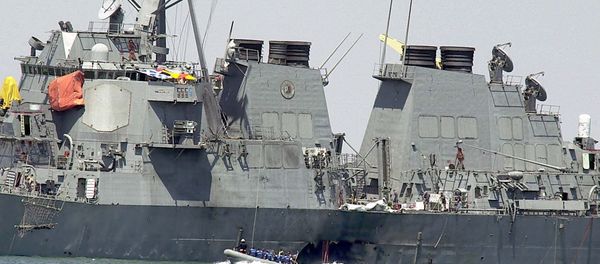 In Sunday, Oct. 15, 2000 file photo, experts in a speed boat examine the damaged hull of the USS Cole at the Yemeni port of Aden after a powerful explosion ripped a hole in the U.S Navy destroyer in the Yemeni port, killing 17 sailors and injuring some 30 others. A federal appeals court on Thursday, June 20, 2013 reinstated a lawsuit by the families of 17 sailors killed in the 2000 bombing of the USS Cole. A three-judge panel of the 4th U.S. Circuit Court of Appeals on Thursday reversed a lower court's dismissal of the lawsuit against Sudan. - Sputnik International