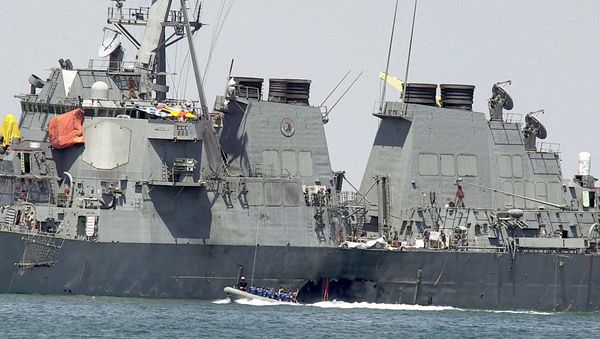 In Sunday, Oct. 15, 2000 file photo, experts in a speed boat examine the damaged hull of the USS Cole at the Yemeni port of Aden after a powerful explosion ripped a hole in the U.S Navy destroyer in the Yemeni port, killing 17 sailors and injuring some 30 others. A federal appeals court on Thursday, June 20, 2013 reinstated a lawsuit by the families of 17 sailors killed in the 2000 bombing of the USS Cole. A three-judge panel of the 4th U.S. Circuit Court of Appeals on Thursday reversed a lower court's dismissal of the lawsuit against Sudan. - Sputnik International
