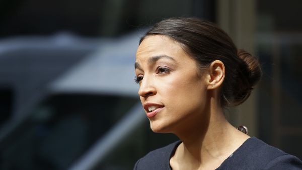 Alexandria Ocasio-Cortez, the winner of a Democratic Congressional primary in New York, talks to the media, Wednesday, June 27, 2018, in New York. Ocasio-Cortez, 28, upset U.S. Rep. Joe Crowley in Tuesday's election. - Sputnik International