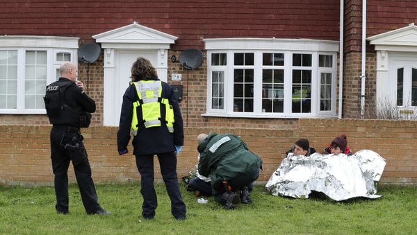 Police, Border Force and paramedics attend to migrants found following a search which was launched when an empty inflatable boat was found on Dungeness beach in Kent, England, Monday, Jan. 7, 2019. Police, Border Force and paramedics attend to migrants found following a search which was launched when an empty inflatable boat was found on Dungeness beach in Kent, England, Monday, Jan. 7, 2019. - Sputnik International