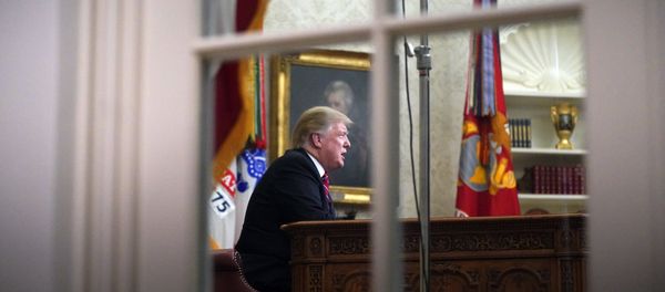 As seen from a window outside the Oval Office, President Donald Trump gives a prime-time address about border security Tuesday, Jan. 8, 2018, at the White House in Washington As seen from a window outside the Oval Office, President Donald Trump gives a prime-time address about border security Tuesday, Jan. 8, 2018, at the White House in Washington - Sputnik International