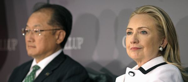 (File photo) World Bank President Jim Yong Kim, left, and Secretary of State Hillary Rodham Clinton wait to address the Gallup Evidence and Impact: Closing the Gender Data Gap conference in Washington, Thursday, July 19, 2012 - Sputnik International