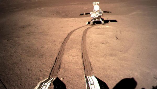 China's lunar rover Yutu-2, or Jade Rabbit 2 rolling onto the far side of the moon taken by the Chang'e-4 lunar probe is seen in this image provided by China National Space Administration January 4, 2019. - Sputnik International