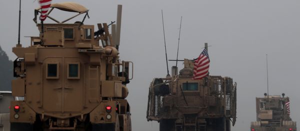 In this file photo taken on December 30, 2018, shows a line of US military vehicles in Syria's northern city of Manbij In this file photo taken on December 30, 2018, shows a line of US military vehicles in Syria's northern city of Manbij - Sputnik International