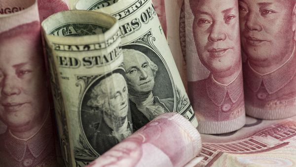 Chinese 100 yuan notes and one US dollar notes in Beijing - Sputnik International