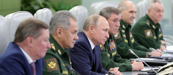 December 26, 2018. Russian President Vladimir Putin watches the launch of the Avangard missile with hypersonic gliding cruise bloc at the National Defense Control Center via a video conference. - Sputnik International
