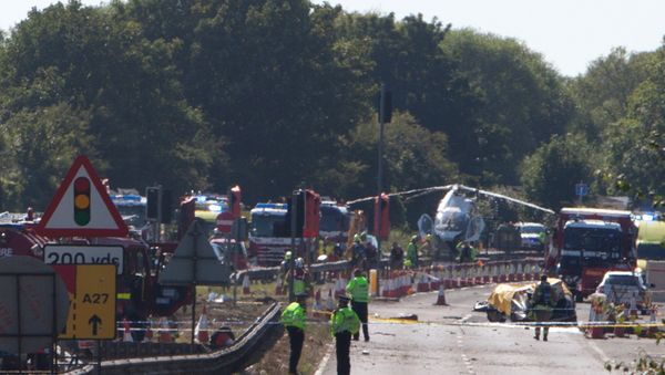 The remains of Andrew Hill's Hawker Hunter strewn over the main A27 road at Shoreham after the August 2015 crash - Sputnik International