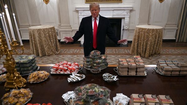 President Donald Trump talks to the media about the table full of fast food in the State Dining Room of the White House in Washington, Monday, Jan. 14, 2019, for the reception for the Clemson Tigers. - Sputnik International