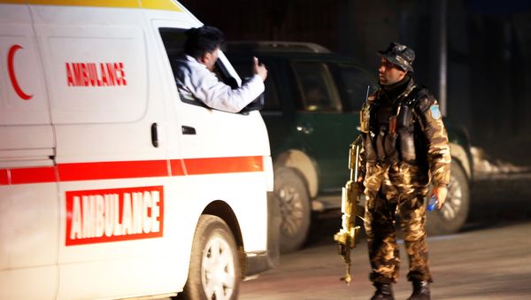 A member of Afghan security force stands guard as ambulance arrive at the site of an attack in Kabul, Afghanistan December 24, 2018 - Sputnik International