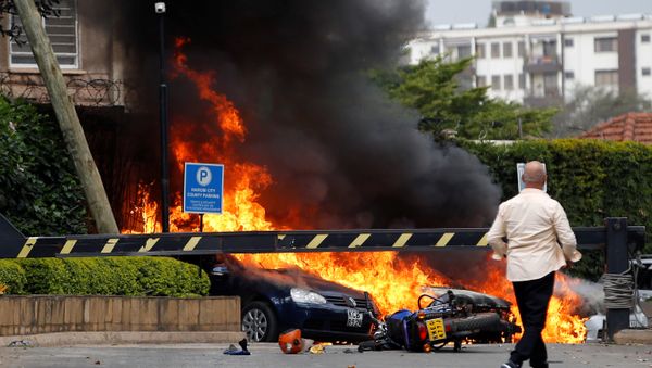 Cars are seen on fire at the scene where explosions and gunshots were heard at the Dusit hotel compound, in Nairobi, Kenya January 15, 2019 - Sputnik International