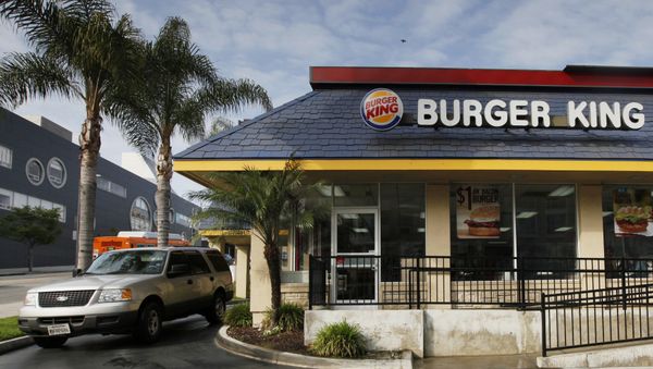 FILE - In this Thursday, April 25, 2013, file photo, a car stops at the drive-thru at a Burger King restaurant near downtown Los Angeles. Restaurant Brands International, the parent company of Burger King and Tim Hortons, reports financial results Monday, Oct. 24, 2016. - Sputnik International