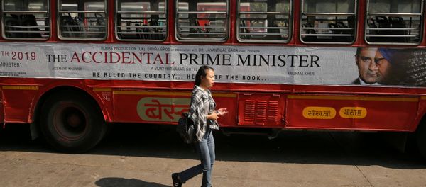 A woman walks past a bus featuring an advertising of the upcoming Bollywood film The Accidental Prime Minister in Mumbai, India, January, 5, 2019 A woman walks past a bus featuring an advertising of the upcoming Bollywood film The Accidental Prime Minister in Mumbai, India, January, 5, 2019 - Sputnik International