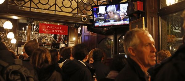 Drinkers watch a television screen in the Red Lion public house on Whitehall, as it shows Britain's Prime Minister Theresa May speaking in the House of Commons in London on January 15, 2019, before MPs vote on the government's Brexit deal - Sputnik International