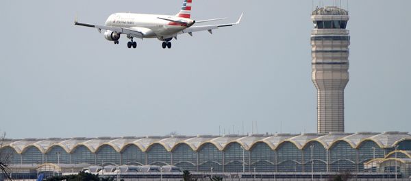 An airplane flies past the tower where air traffic controllers work despite not receiving their paychecks, on the 22nd day of a partial government shutdown at Reagan National Airport in Washington, U.S., January 12, 2019 An airplane flies past the tower where air traffic controllers work despite not receiving their paychecks, on the 22nd day of a partial government shutdown at Reagan National Airport in Washington, U.S., January 12, 2019 - Sputnik International