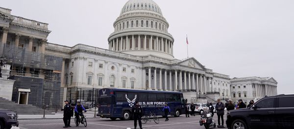 A U.S. Air Force bus meant to transport U.S. Speaker of the House Nancy Pelosi and other members of a congressional delegation to a flight to Belgium and Afghanistan sits guarded by U.S. Capitol Police in front of the Capitol after President Donald Trump cancelled the Air Force flight as the president's dispute with congressional Democrats over the partial government shutdown continues in Washington, U.S., January 17, 2019 A U.S. Air Force bus meant to transport U.S. Speaker of the House Nancy Pelosi and other members of a congressional delegation to a flight to Belgium and Afghanistan sits guarded by U.S. Capitol Police in front of the Capitol after President Donald Trump cancelled the Air Force flight as the president's dispute with congressional Democrats over the partial government shutdown continues in Washington, U.S., January 17, 2019 - Sputnik International