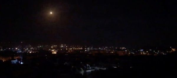 What is believed to be guided missiles are seen in the sky during what is reported to be an attack in Damascus, Syria, January 21, 2019, in this still image taken from a video obtained from social media - Sputnik International