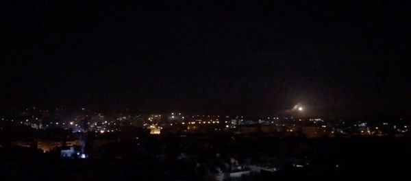 What is believed to be guided missiles are seen in the sky during what is reported to be an attack in Damascus, Syria, January 21, 2019, in this still image taken from a video obtained from social media - Sputnik International