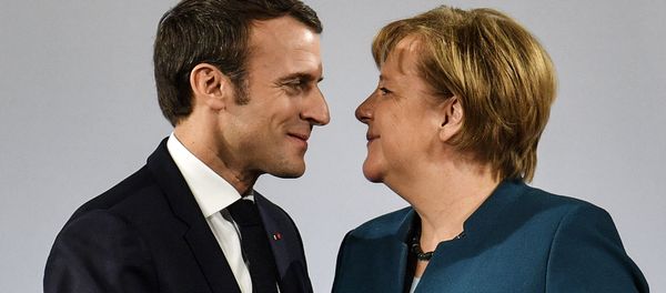 German Chancellor Angela Merkel watches French President Emmanuel Macron after the signing of a new Germany-France friendship treaty at the historic Town Hall in Aachen, Germany, Tuesday, Jan. 22, 2019 German Chancellor Angela Merkel watches French President Emmanuel Macron after the signing of a new Germany-France friendship treaty at the historic Town Hall in Aachen, Germany, Tuesday, Jan. 22, 2019 - Sputnik International