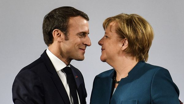 German Chancellor Angela Merkel watches French President Emmanuel Macron after the signing of a new Germany-France friendship treaty at the historic Town Hall in Aachen, Germany, Tuesday, Jan. 22, 2019 - Sputnik International