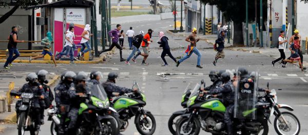 Police secure the area during a protest against Venezuelan President Nicolas Maduro's government in Caracas, Venezuela January 23, 2019. Police secure the area during a protest against Venezuelan President Nicolas Maduro's government in Caracas, Venezuela January 23, 2019. - Sputnik International
