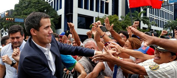 Juan Guaido, President of Venezuela's National Assembly, greets supporters during a rally against Venezuelan President Nicolas Maduro's government and to commemorate the 61st anniversary of the end of the dictatorship of Marcos Perez Jimenez in Caracas, Venezuela January 23, 2019 - Sputnik International