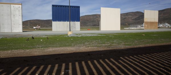 Prototypes of border wall sit behind the bars of the current border wall, Tuesday, Jan. 8, 2019, seen from Tijuana, Mexico - Sputnik International
