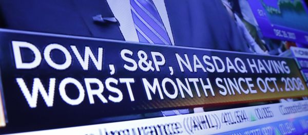 A headline on a television screen on the floor of the New York Stock Exchange A headline on a television screen on the floor of the New York Stock Exchange - Sputnik International