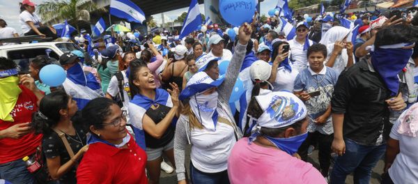 Protestors wave balloons and Nicaraguan flags during an anti-government event coined The March of Balloons in Managua, Nicaragua, Sunday, Sept. 9, 2018. The march aimed to raise awareness of what protesters call political prisoners and demand their release. - Sputnik International
