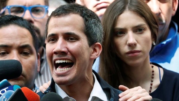Venezuelan opposition leader and self-proclaimed interim president Juan Guaido accompanied by his wife Fabiana Rosales, speaks to the media after a holy mass in Caracas, Venezuela, January 27, 2019 - Sputnik International
