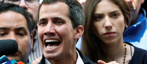 Venezuelan opposition leader and self-proclaimed interim president Juan Guaido accompanied by his wife Fabiana Rosales, speaks to the media after a holy mass in Caracas, Venezuela, January 27, 2019 - Sputnik International