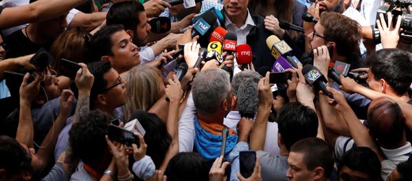 Venezuelan opposition leader and self-proclaimed interim president Juan Guaido accompanied by his wife Fabiana Rosales, speaks to the media after a holy Mass at a local church in Caracas, Venezuela, January 27, 2019 - Sputnik International