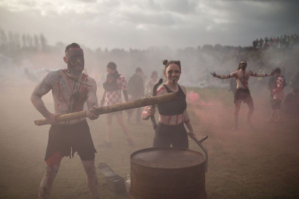 Performers beat their drums and release flares in an attempt to motivate competitors prior to the start of the Tough Guy endurance event near Wolverhampton Performers beat their drums and release flares in an attempt to motivate competitors prior to the start of the Tough Guy endurance event near Wolverhampton - Sputnik International