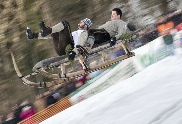 Two men ride in a traditional sled called a Schnabler during a race in Gaissach, southern Germany Two men ride in a traditional sled called a Schnabler during a race in Gaissach, southern Germany - Sputnik International
