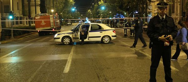 Greek police secure the area after a bomb blast in central Athens, Greece Greek police secure the area after a bomb blast in central Athens, Greece - Sputnik International