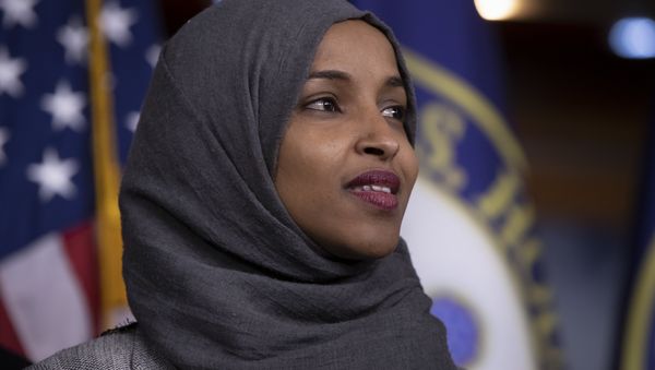 Rep.-elect Ilhan Omar, D-Minn., joins House Democratic Leader Nancy Pelosi of California and newly-elected members at a news conference to discuss their priorities when they assume the majority in the 116th Congress in January, at the Capitol in Washington, Friday, Nov. 30, 2018 - Sputnik International