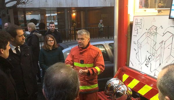 French Interior Minister Christophe Castaner listens as a fire brigade officer explains how the Paris blaze spread French Interior Minister Christophe Castaner listens as a fire brigade officer explains how the Paris blaze spread - Sputnik International
