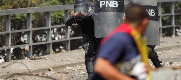 A National Police officer fires rubber bullets during a protest against Venezuelan President Nicolas Maduro's government in Caracas, Venezuela January 23, 2019 A National Police officer fires rubber bullets during a protest against Venezuelan President Nicolas Maduro's government in Caracas, Venezuela January 23, 2019 - Sputnik International