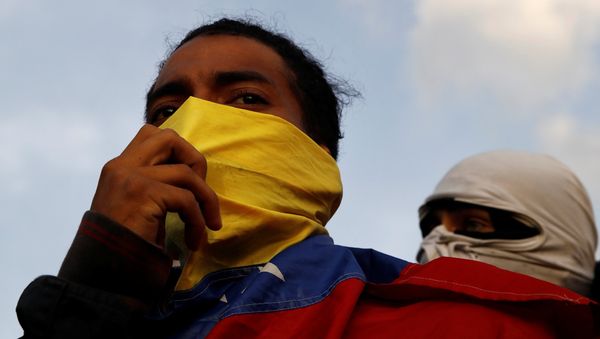 Demonstrators are seen during a protest against Venezuelan President Nicolas Maduro's government in Caracas, Venezuela February 2, 2019 - Sputnik International