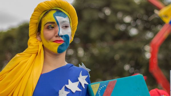 A woman takes part in a rally in support of the Venezuelan President Nicolas Maduro, in Caracas, Venezuela - Sputnik International