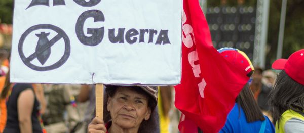 A woman takes part in a rally in support of the Venezuelan President Nicolas Maduro, in Caracas, Venezuela. A woman takes part in a rally in support of the Venezuelan President Nicolas Maduro, in Caracas, Venezuela. - Sputnik International