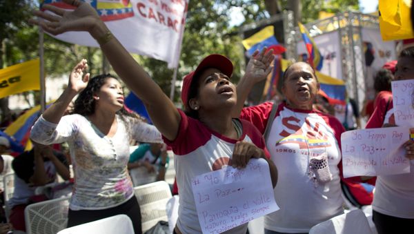 Supporters of President Nicolas Maduro sing a song about Venezuela's late president Hugo Chavez, during a event at Bolivar Square in Caracas, Venezuela, Thursday, Feb. 7, 2019 Supporters of President Nicolas Maduro sing a song about Venezuela's late president Hugo Chavez, during a event at Bolivar Square in Caracas, Venezuela, Thursday, Feb. 7, 2019 - Sputnik International