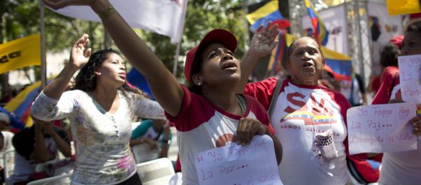 Supporters of President Nicolas Maduro sing a song about Venezuela's late president Hugo Chavez, during a event at Bolivar Square in Caracas, Venezuela, Thursday, Feb. 7, 2019 Supporters of President Nicolas Maduro sing a song about Venezuela's late president Hugo Chavez, during a event at Bolivar Square in Caracas, Venezuela, Thursday, Feb. 7, 2019 - Sputnik International