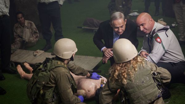 Israeli Prime Minister Benjamin Netanyahu, center right, stands next to soldiers during a drill at a new training military base, near the southern city of Beer Sheva, Israel, Tuesday, Nov. 15, 2016 Israeli Prime Minister Benjamin Netanyahu, center right, stands next to soldiers during a drill at a new training military base, near the southern city of Beer Sheva, Israel, Tuesday, Nov. 15, 2016 - Sputnik International