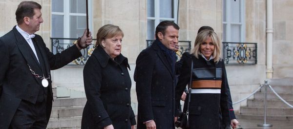 Germany's Angela Merkel and France's Emmanuel Macron at France Armistice Day - Sputnik International