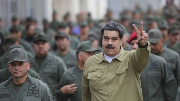 In this handout photo released by the Miraflores Presidential Press Office, Venezuela's President Nicolas Maduro flashes a V for Victory hand gesture after arriving at the Fort Tiuna military base in Caracas, Venezuela, Wednesday, Jan. 30, 2019. In this handout photo released by the Miraflores Presidential Press Office, Venezuela's President Nicolas Maduro flashes a V for Victory hand gesture after arriving at the Fort Tiuna military base in Caracas, Venezuela, Wednesday, Jan. 30, 2019. - Sputnik International
