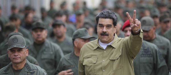 In this handout photo released by the Miraflores Presidential Press Office, Venezuela's President Nicolas Maduro flashes a V for Victory hand gesture after arriving at the Fort Tiuna military base in Caracas, Venezuela, Wednesday, Jan. 30, 2019. - Sputnik International